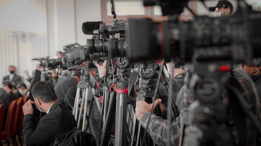 Photographers and reporters covering a red carpet event